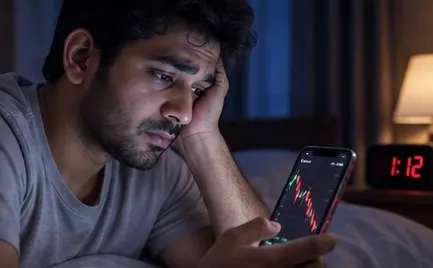 A worried man checking charts in bed at 1:12 AM